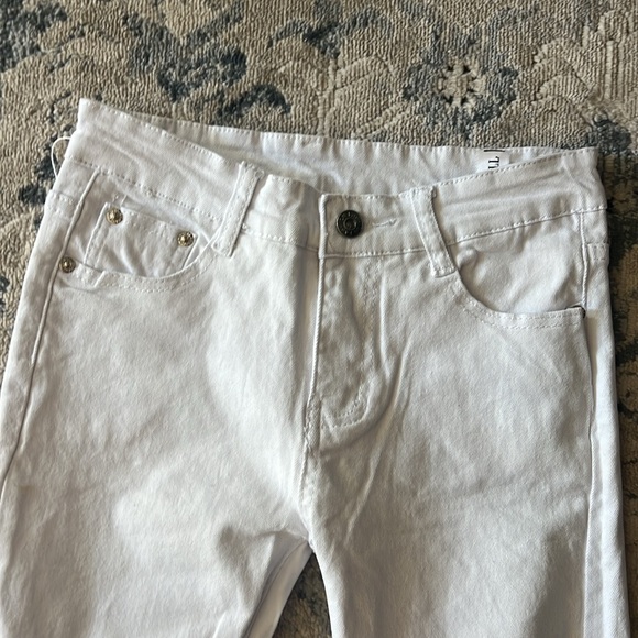 Boys size 10 white jeans with rips in them. - Picture 2 of 6